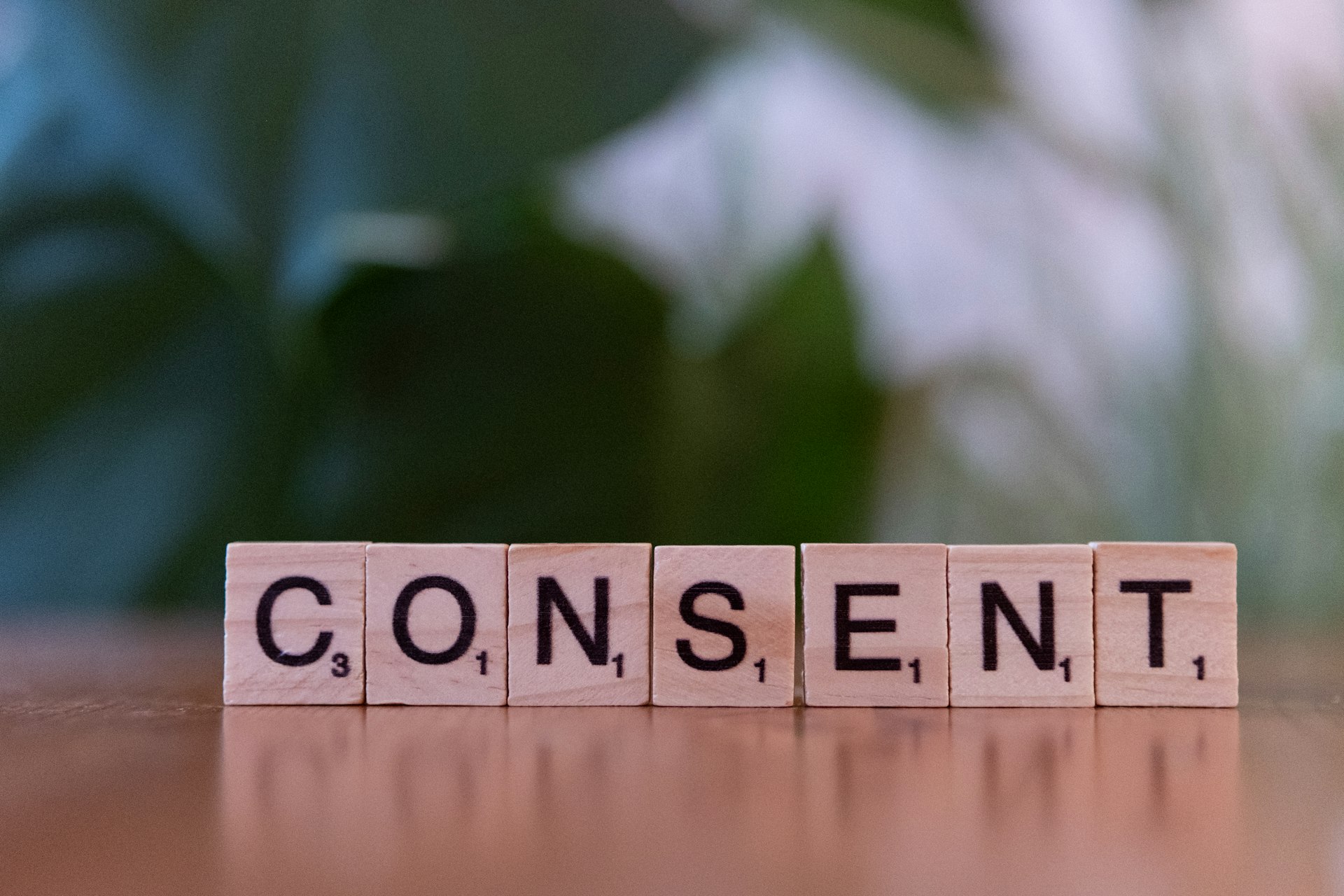 A wooden block spelling the word content on a table